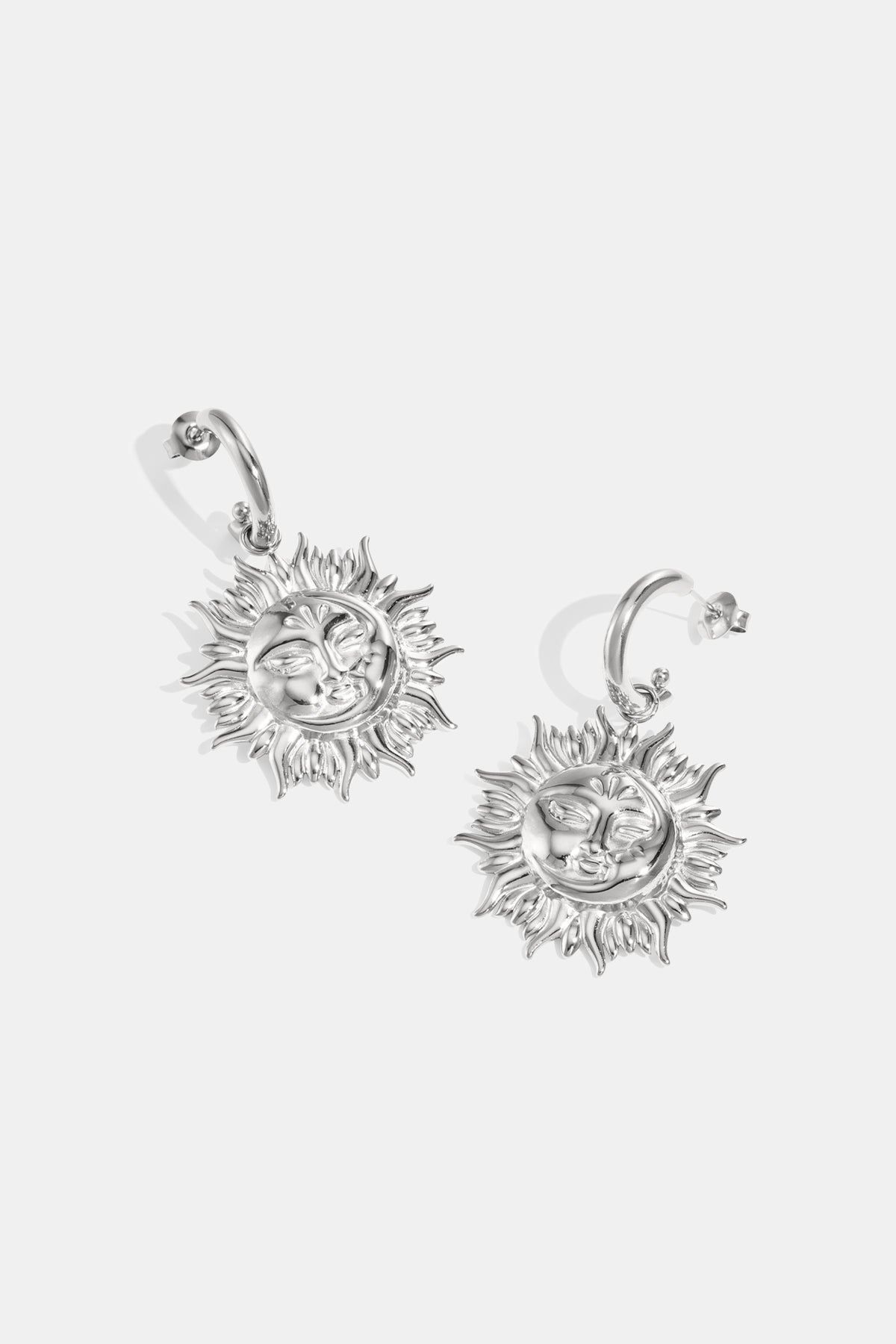 Stainless steel dangle earrings for women with sun motif – gold-colored