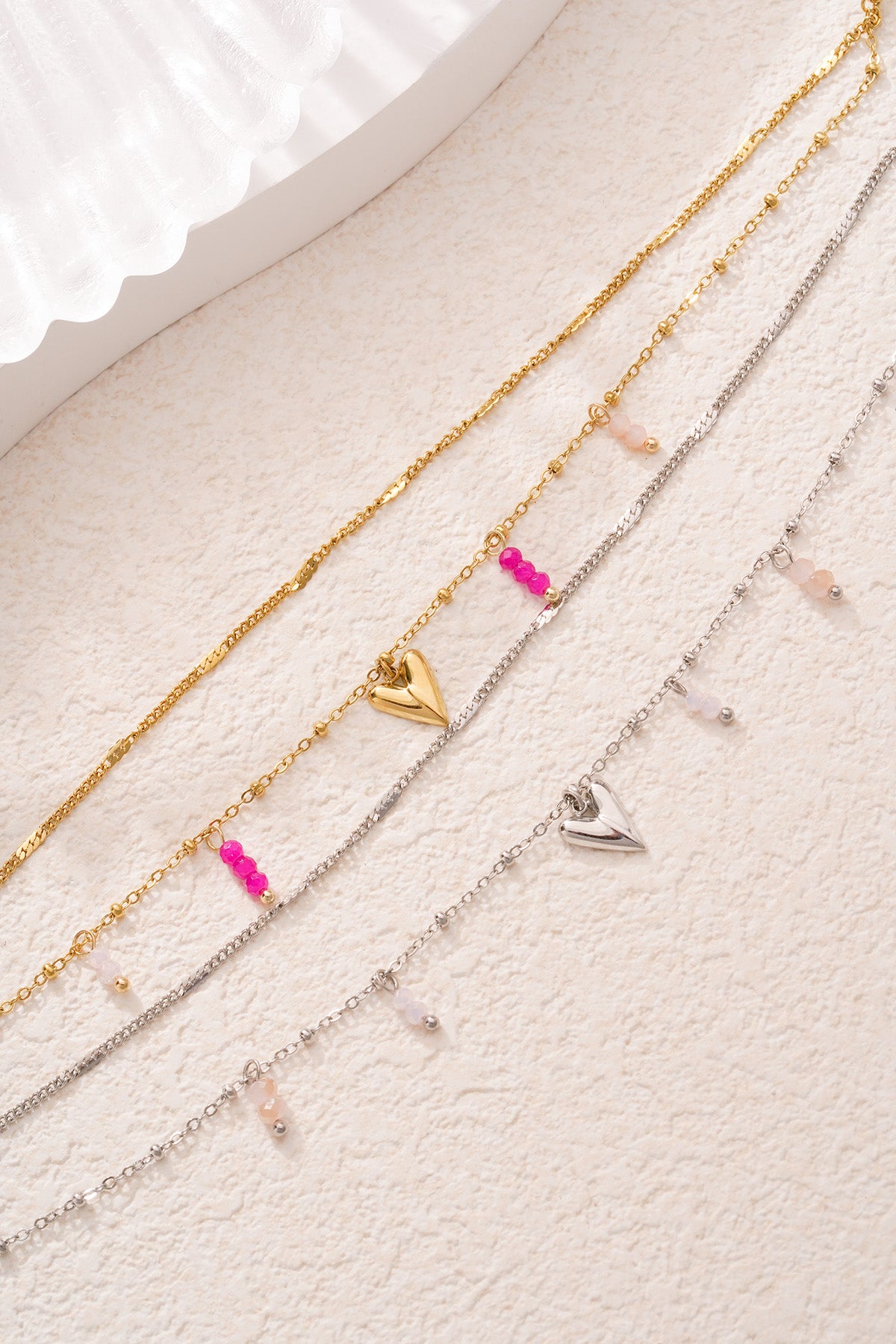 Bracelet à breloques pour femmes en acier inoxydable avec cœur – ton or et ton argent – photo 5